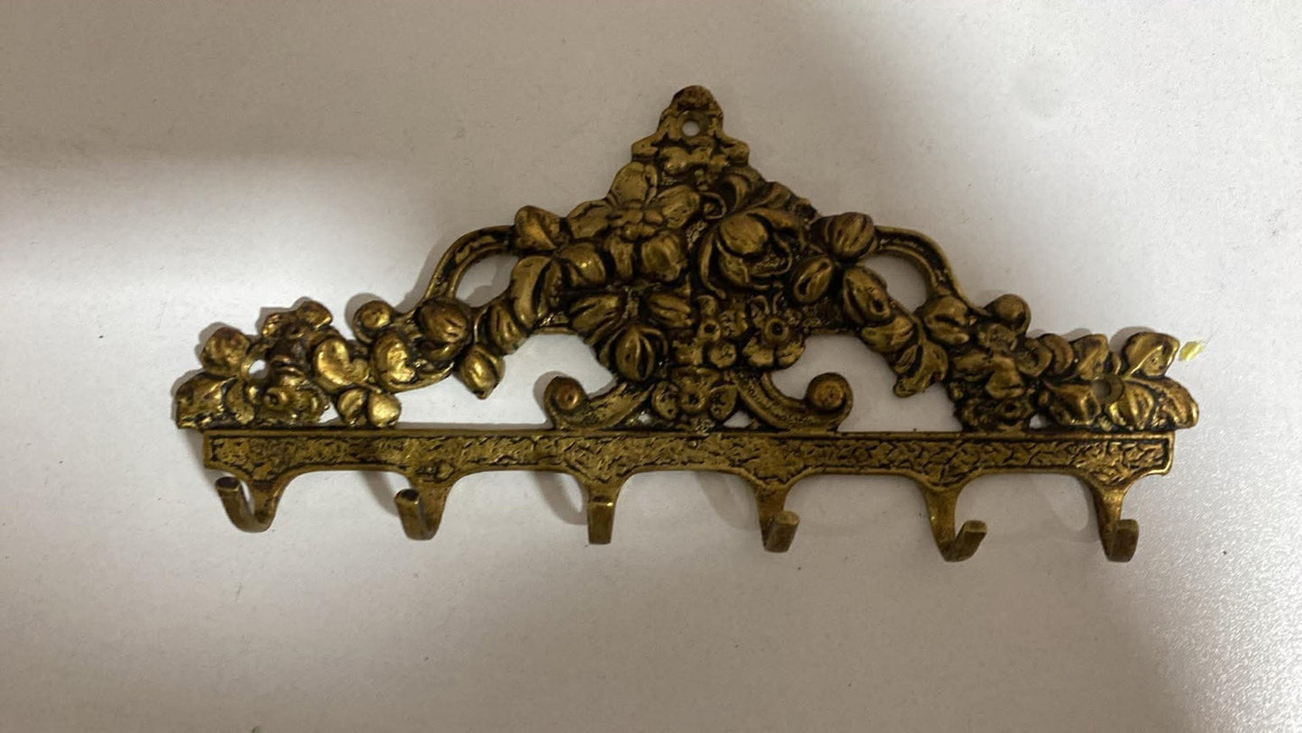 Ornamentale Wandhakenleiste aus Messing im Barockstil